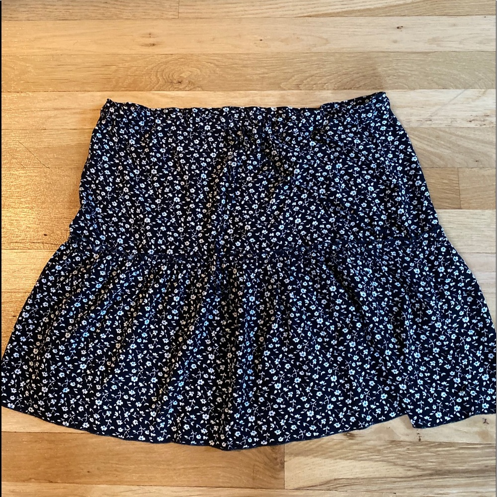 Brandy Melville navy blue skirt with flowers.